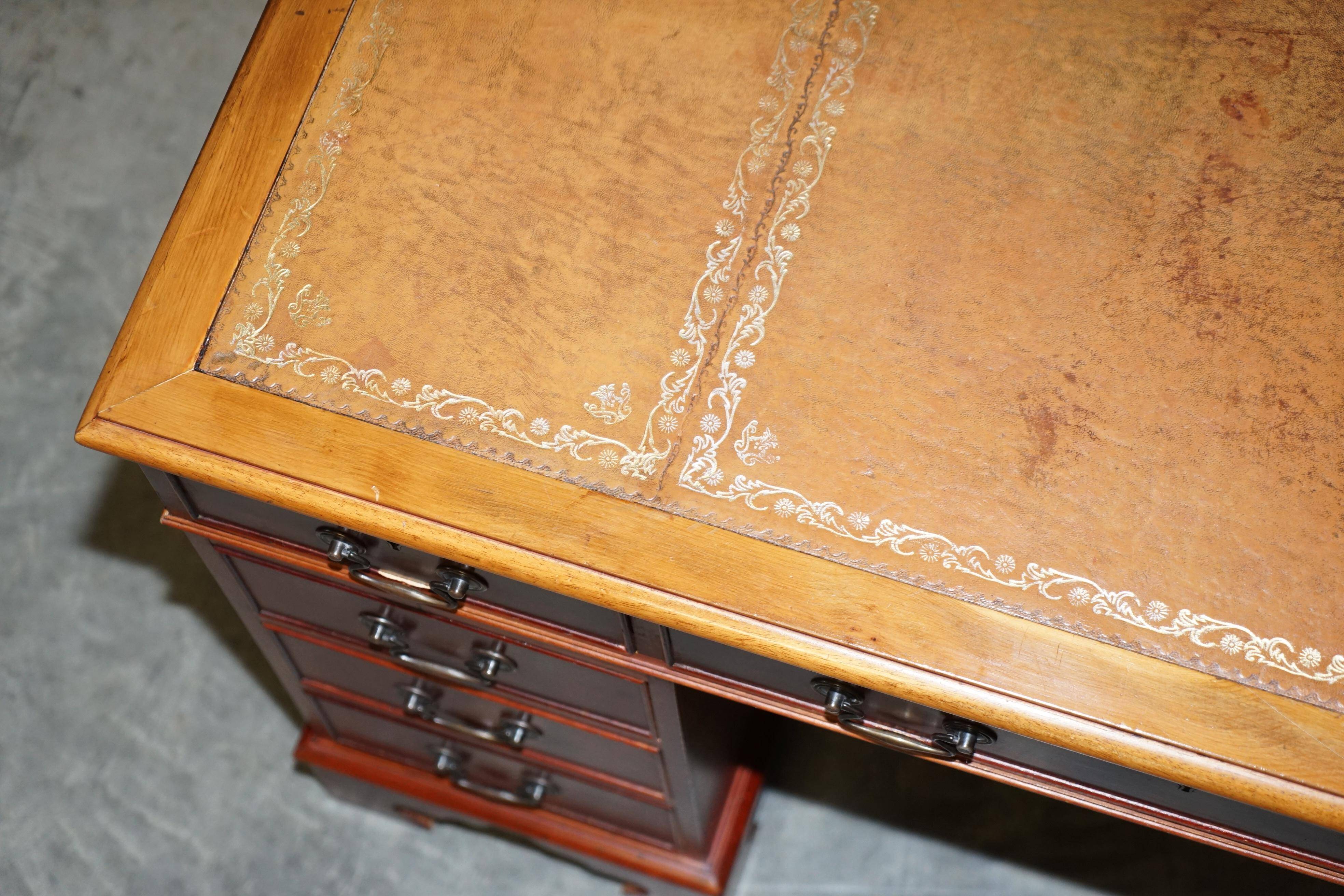 Vintage walnut desk with a leather top and two drawers.