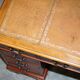 Vintage walnut desk with a leather top and two drawers.
