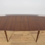 Extendable teak dining table in Mid-Century style from McIntosh, UK.