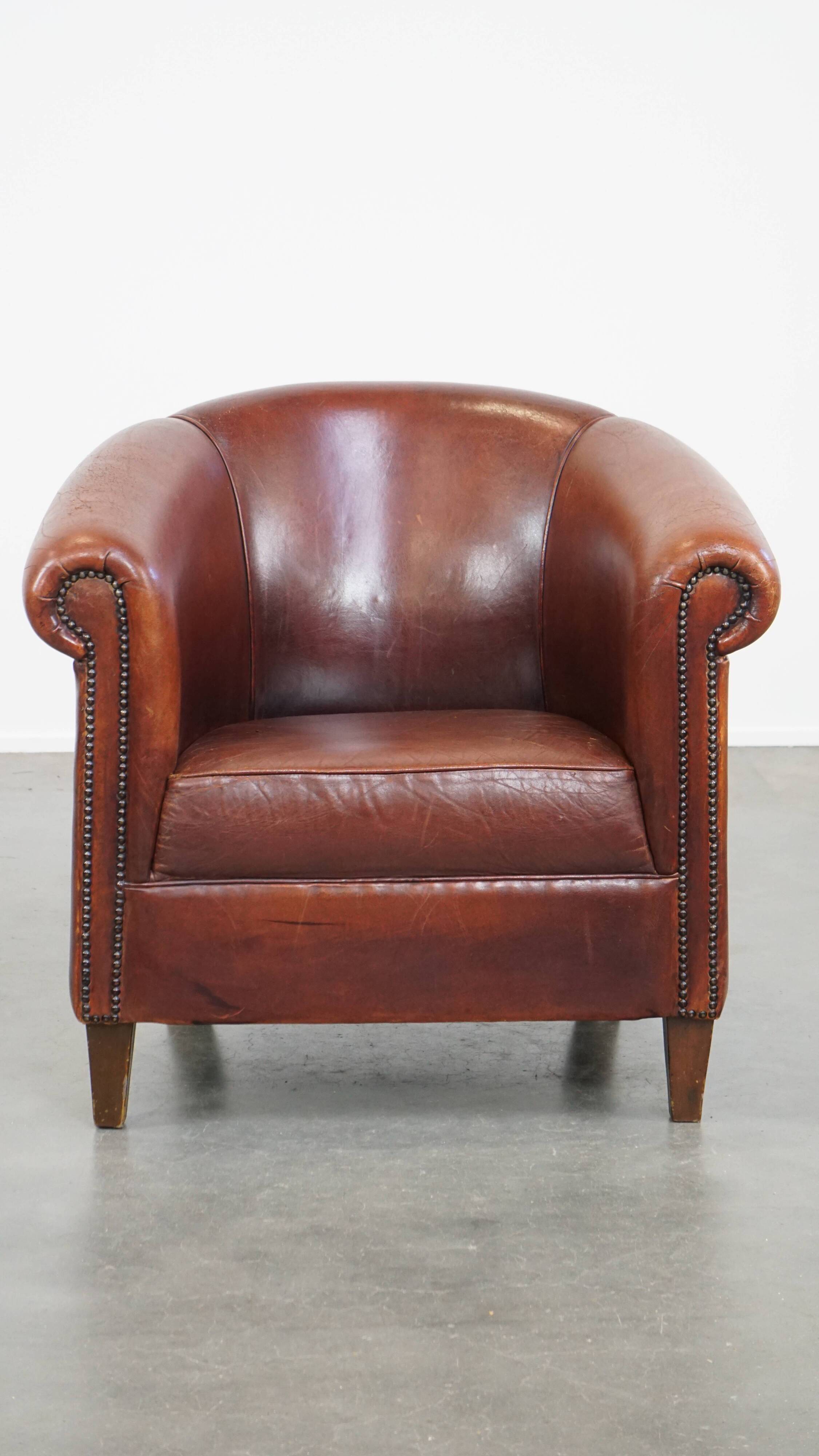 English style sheepskin club chair with a beautiful patina