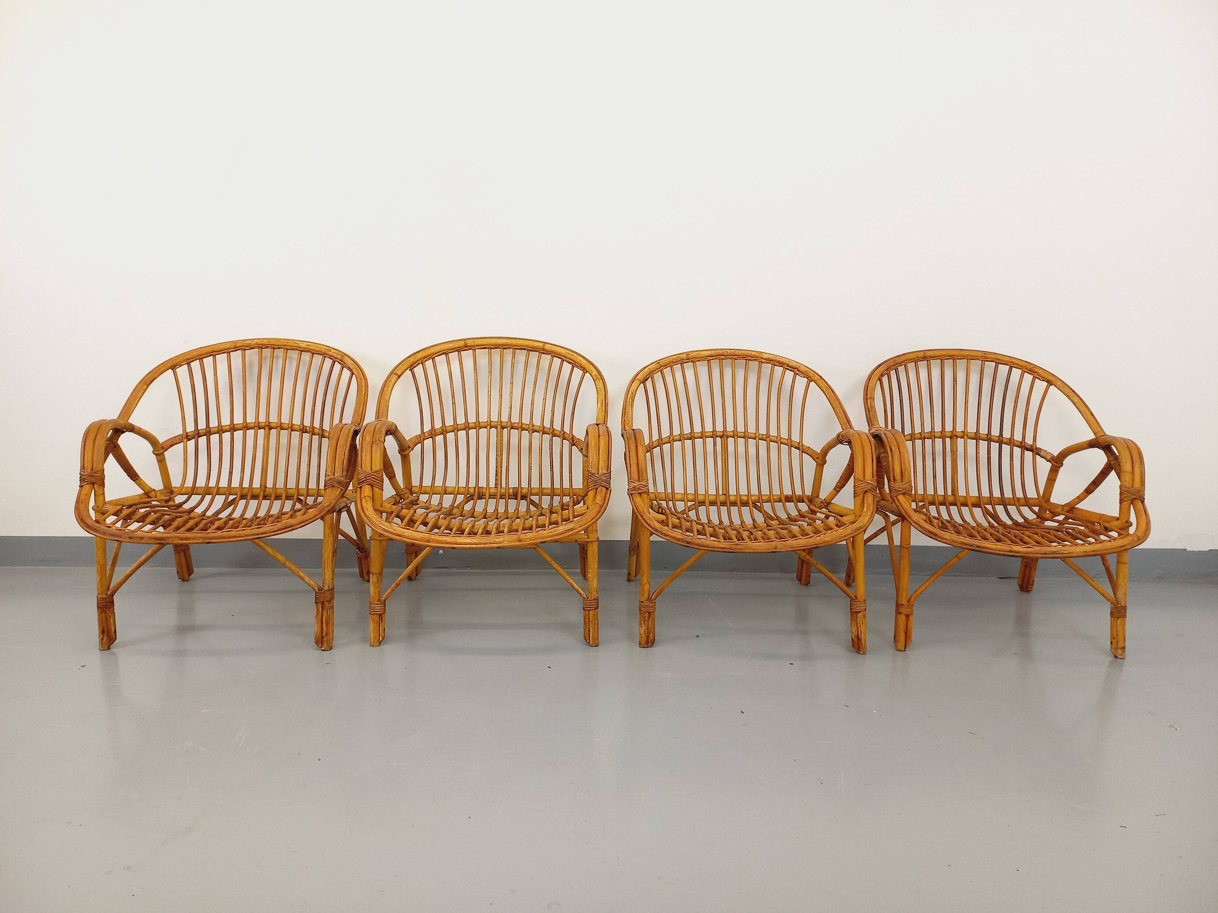 Set of 4 vintage rattan armchairs from the 60s