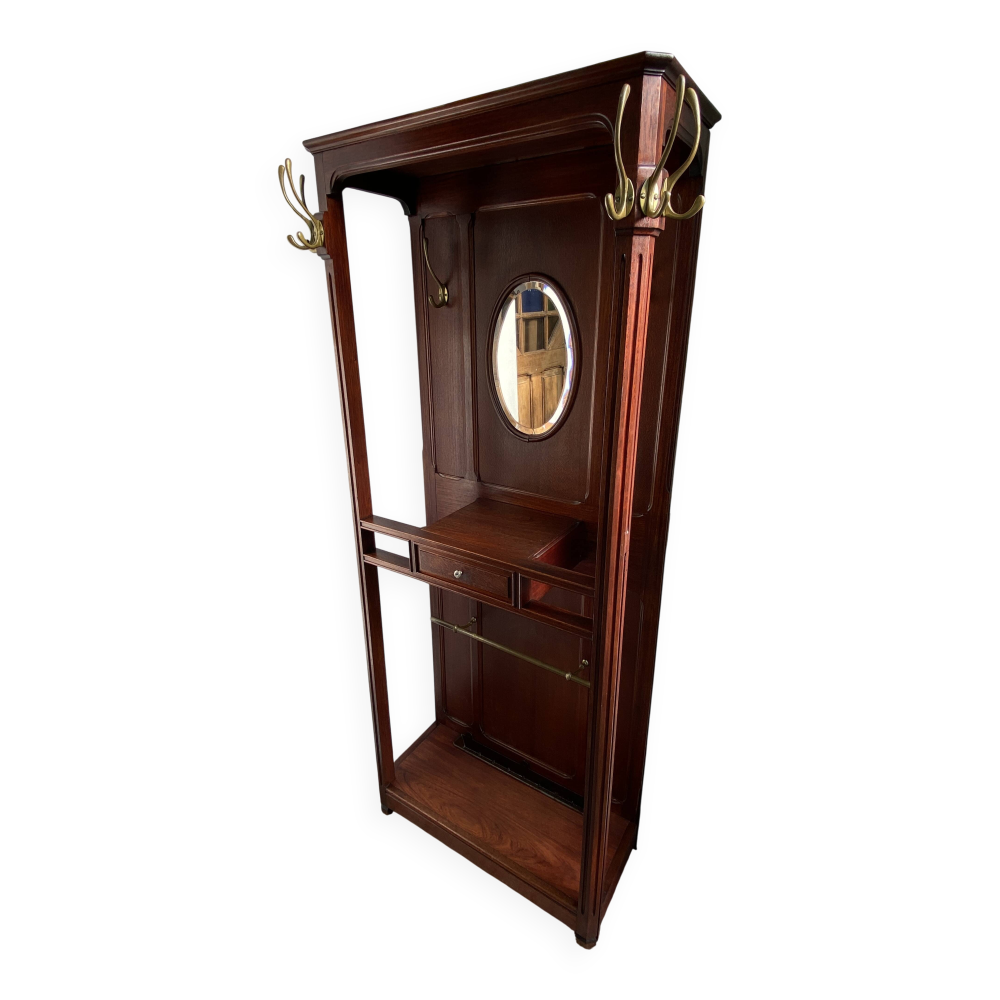 Antique wooden coat rack with mirror and shelf.