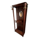 Antique wooden coat rack with mirror and shelf.