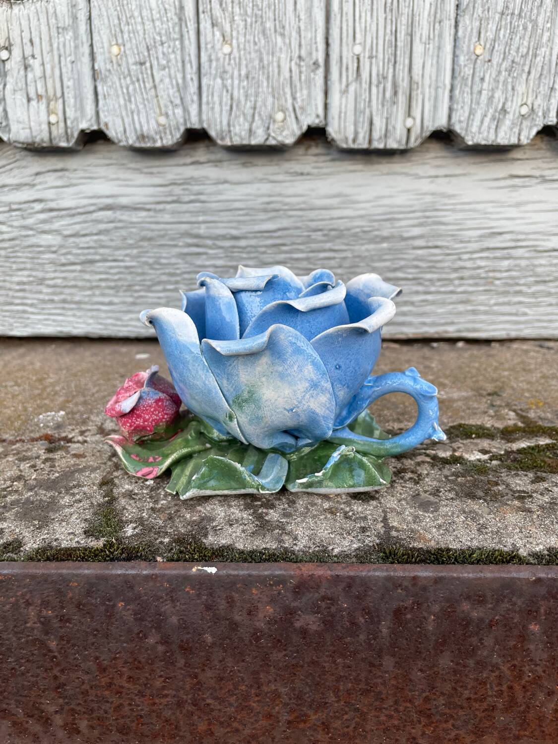 Old barbotine candle holder in the shape of a rose