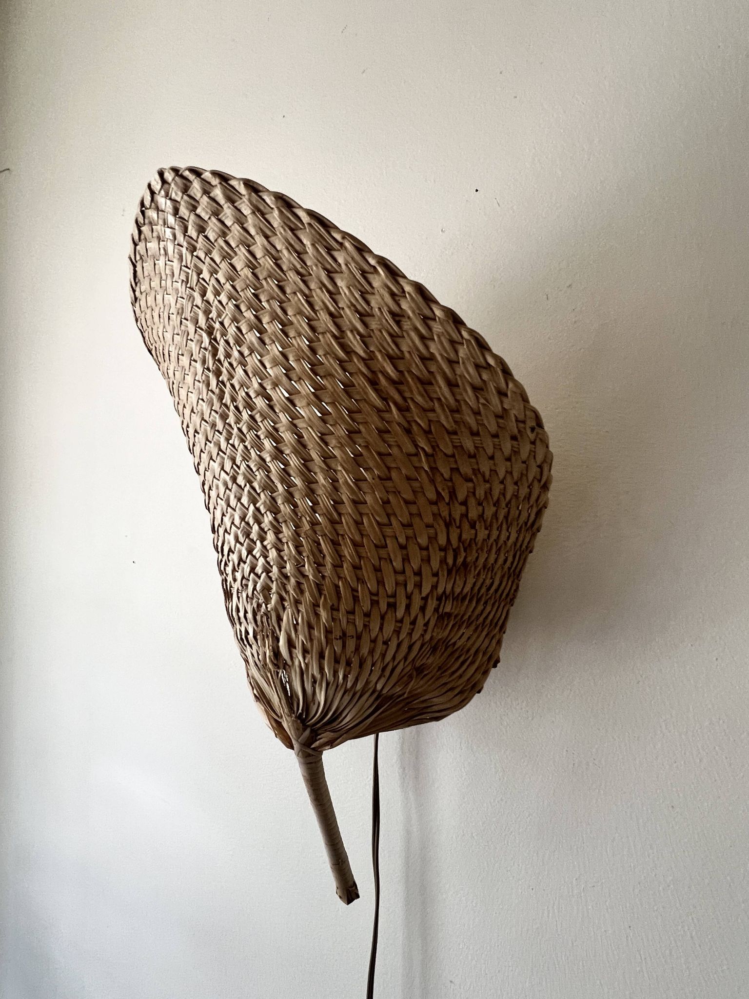 Woven rattan wall light in the style of Igno Maurer, design from the 1970s.