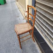 Antique wooden chair with cane seating