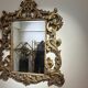 Gold wooden wall mirror with floral decoration