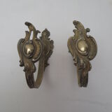 Pair of embraces in brass or bronze