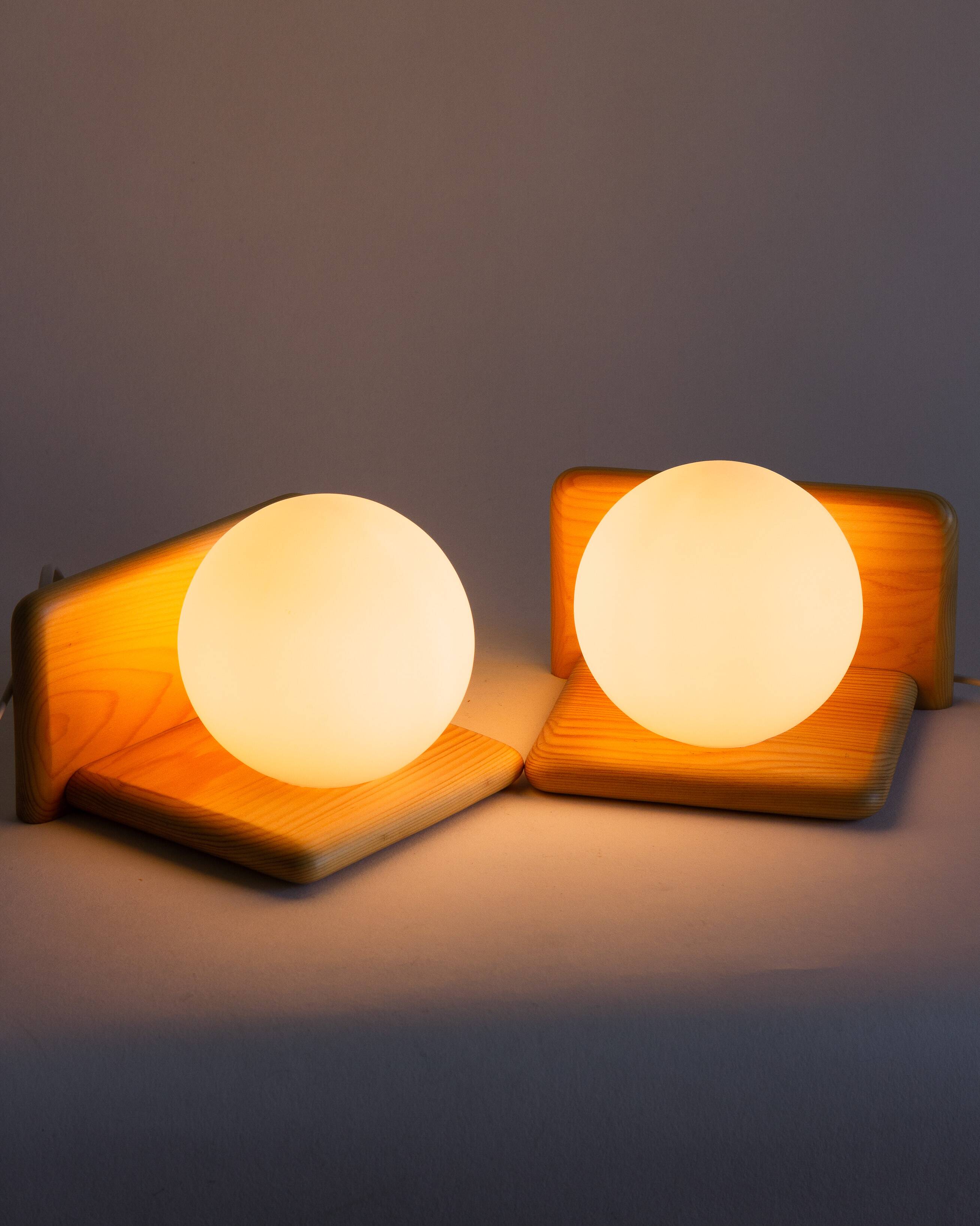 Duo of pine and opaline glass wall lights, 1980s