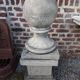 Ball on base in gray patinated reconstituted stone