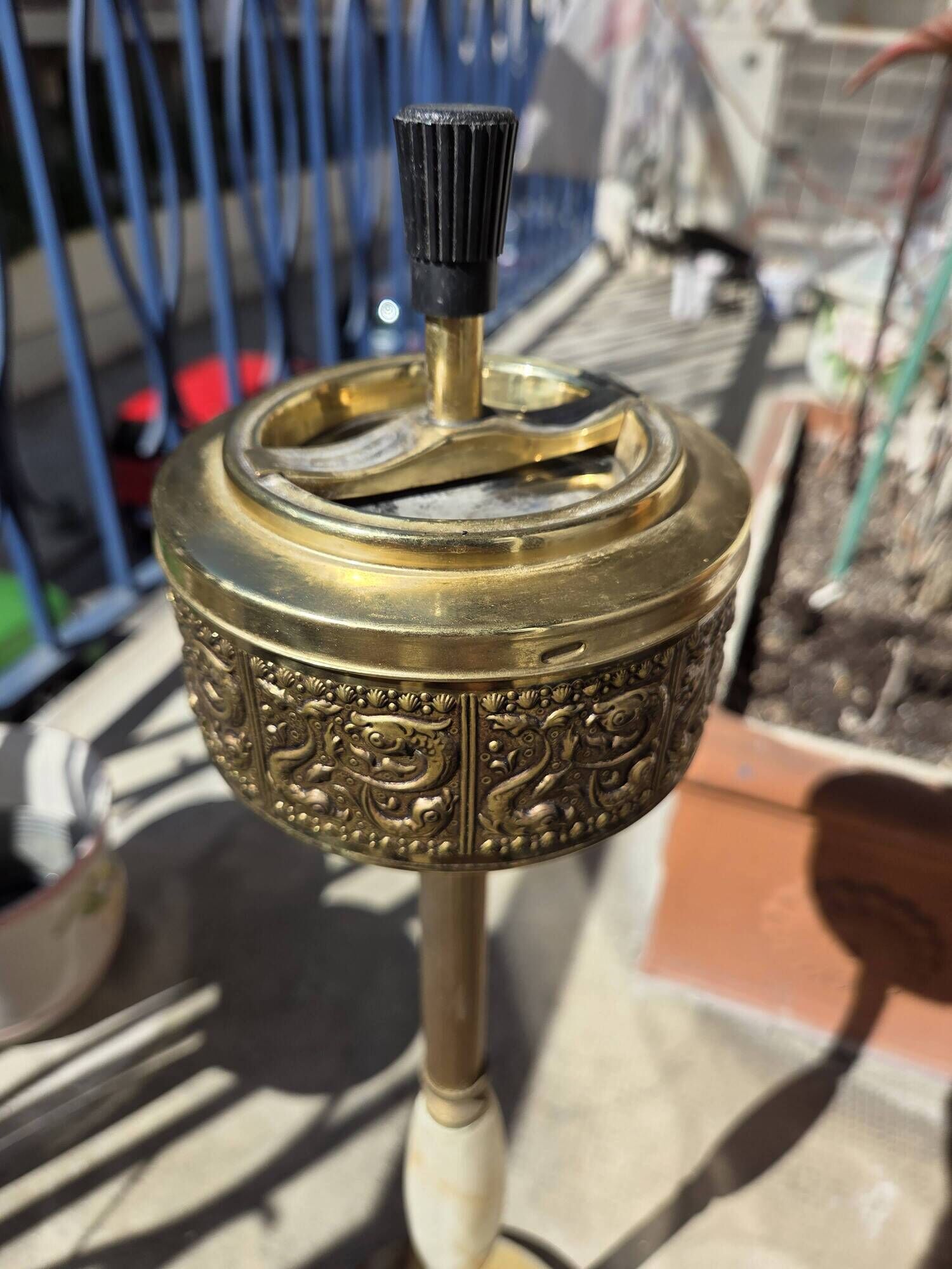 Floor ashtray in gilded brass (frieze of fish)