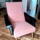 Fauteuil vintage en bouclette vieux rose et cuir noir