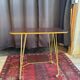Vintage 1960s rolling dessert trolley in gold metal and formica.