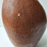 Terracotta face sculpture in African art style