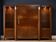 Important Art Deco library in amboyna and mahogany veneer.