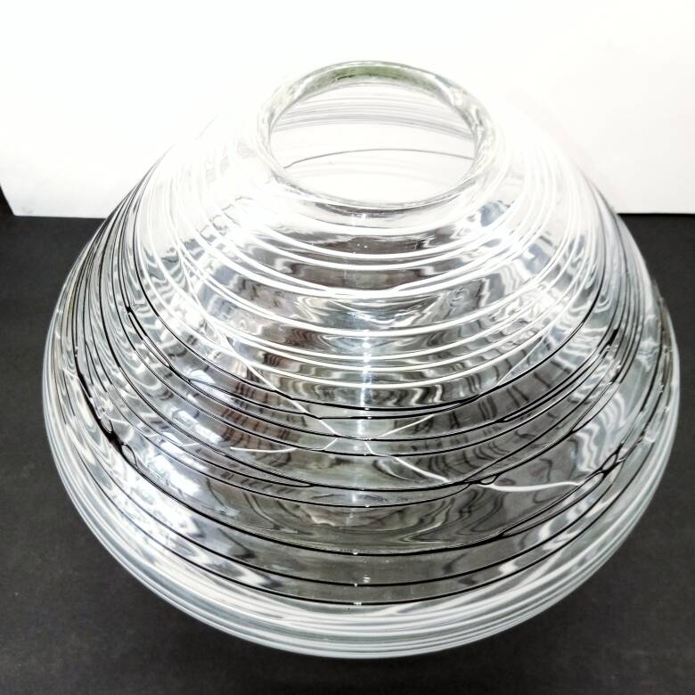 Textured oval blown glass vase with black and white glass spaghetti.