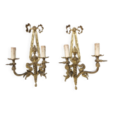 Pair of antique bronze wall lights. Louis style candlestick lamps.