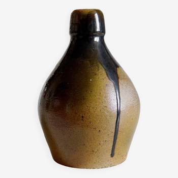 Glazed ceramic bottle signed