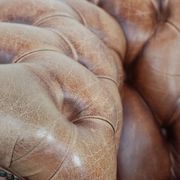 Chesterfield armchair in English style made of cowhide leather
