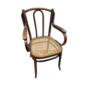 Curved wooden armchair