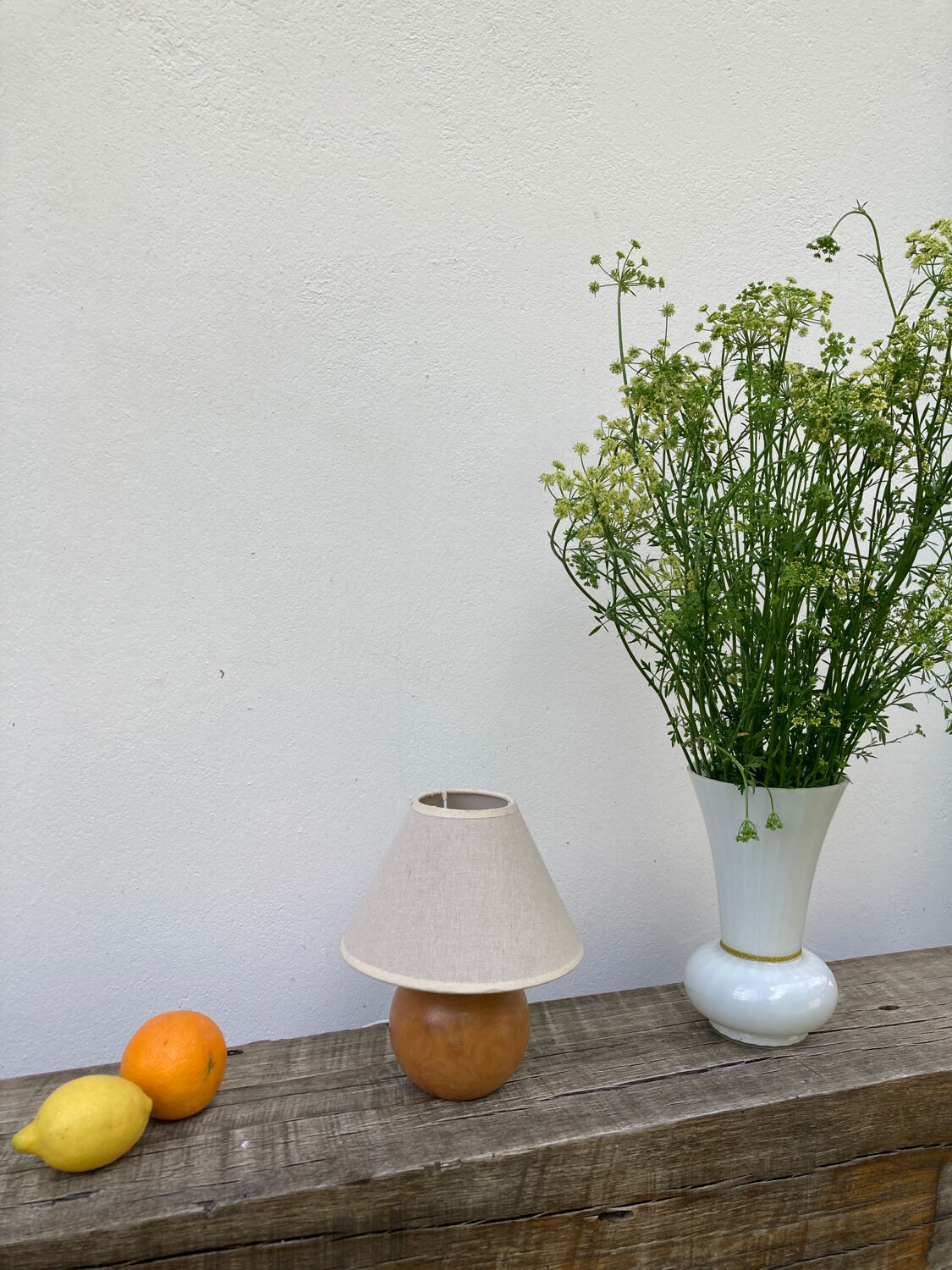Wooden ball bedside lamp and beige lampshade