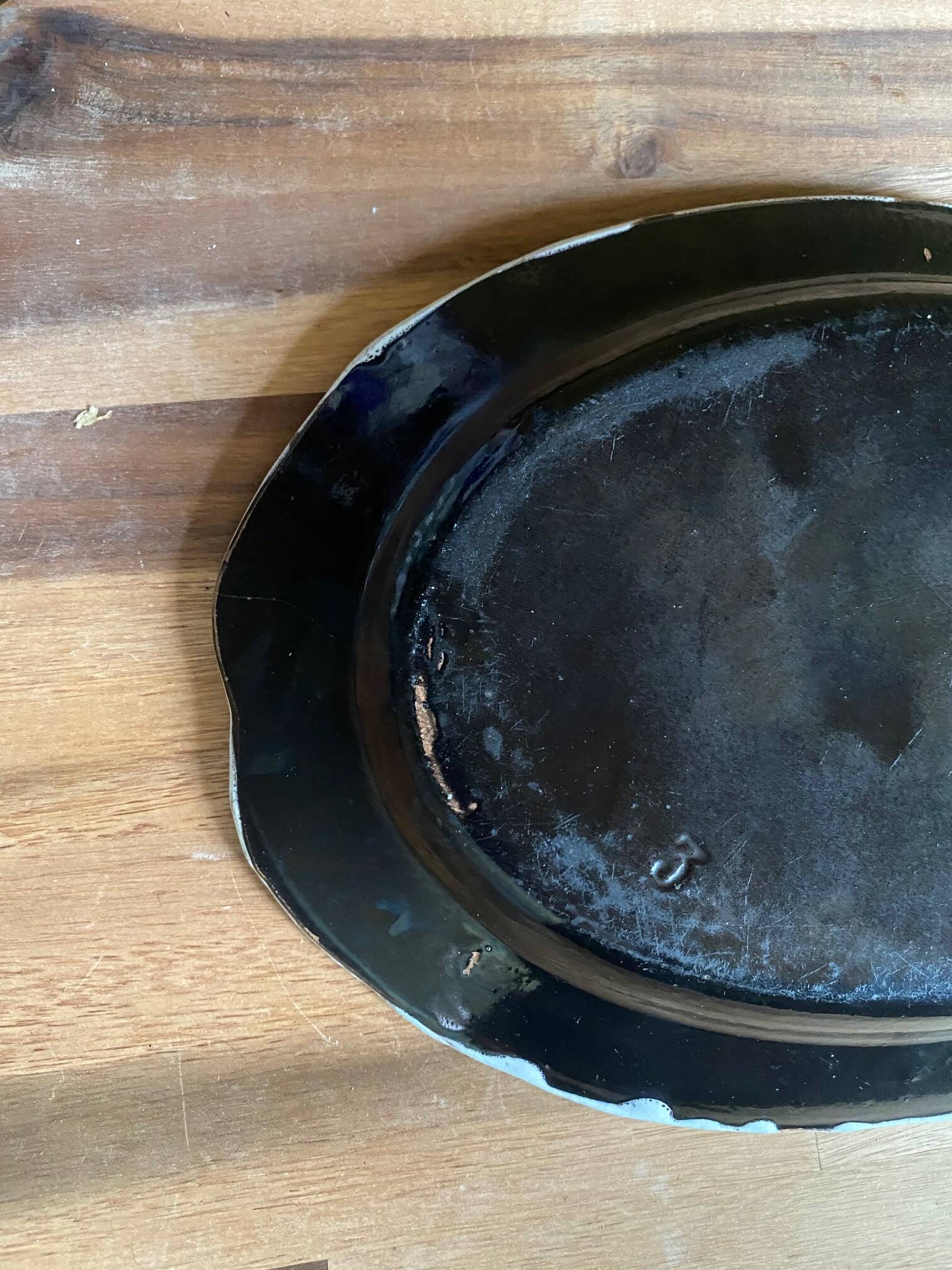 Ceramic plate, antique late 19th - early 20th century, known as "Cul-noir" from Normandy.