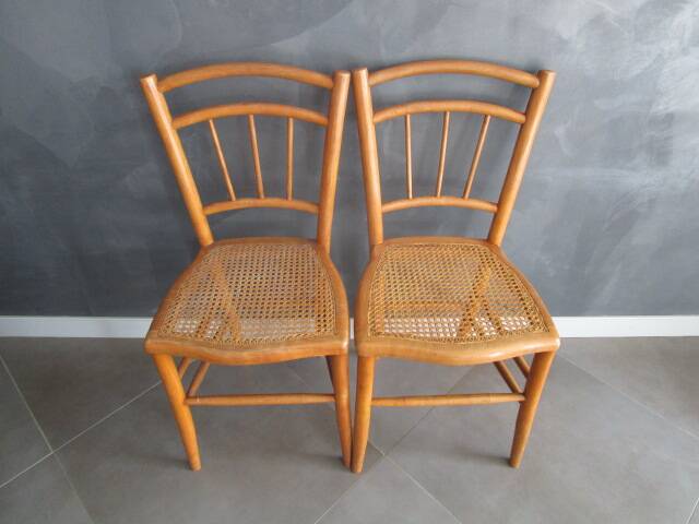 Pair of old caned chairs in blond wood