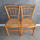 Pair of old caned chairs in blond wood