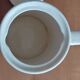 Small coffee maker with floral decoration