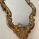 Old italian mirror in gilded plaster with leaf