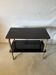 Vintage dessert trolley, black wood and brass supports.