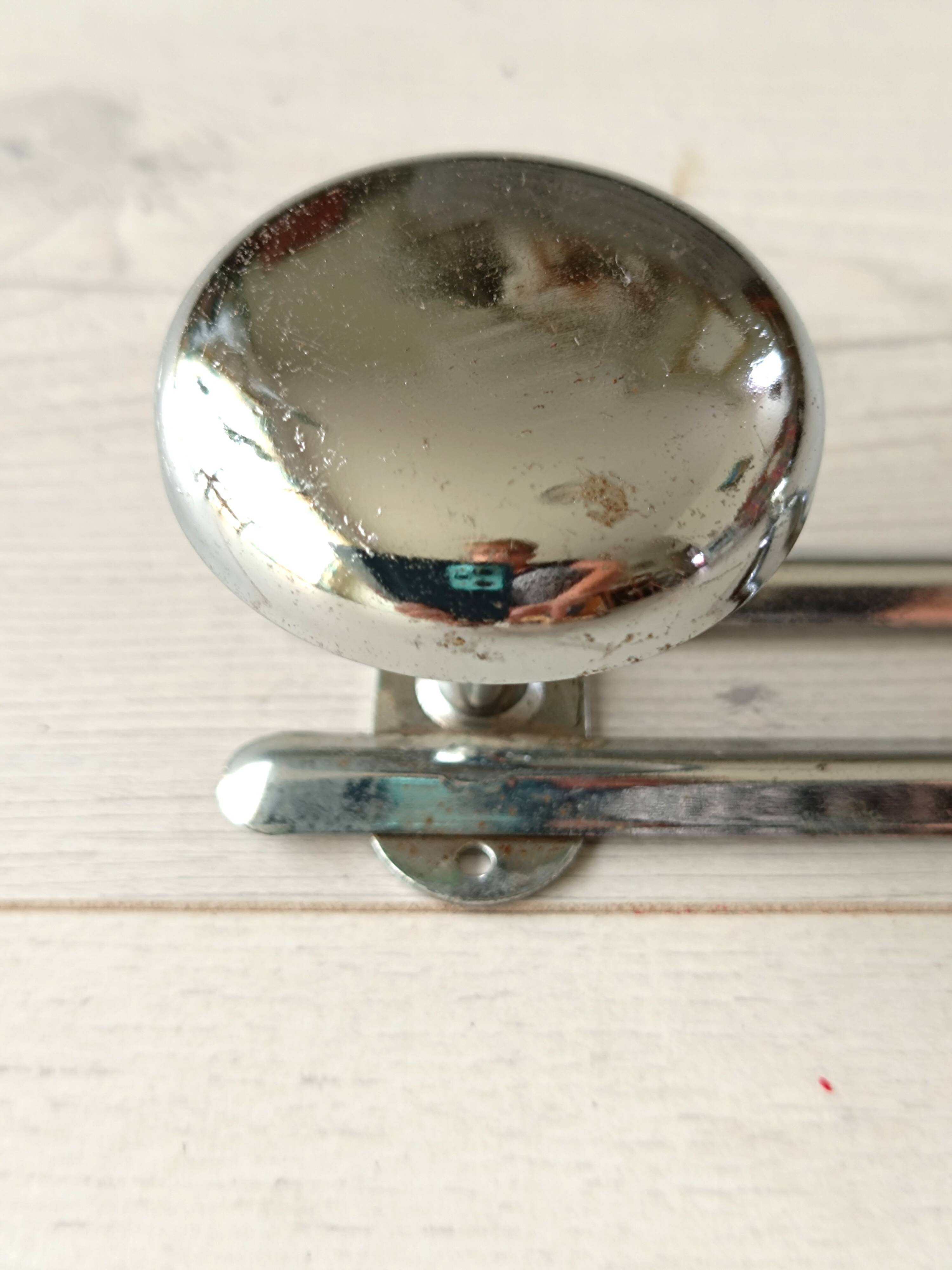 Chrome metal wall coat rack