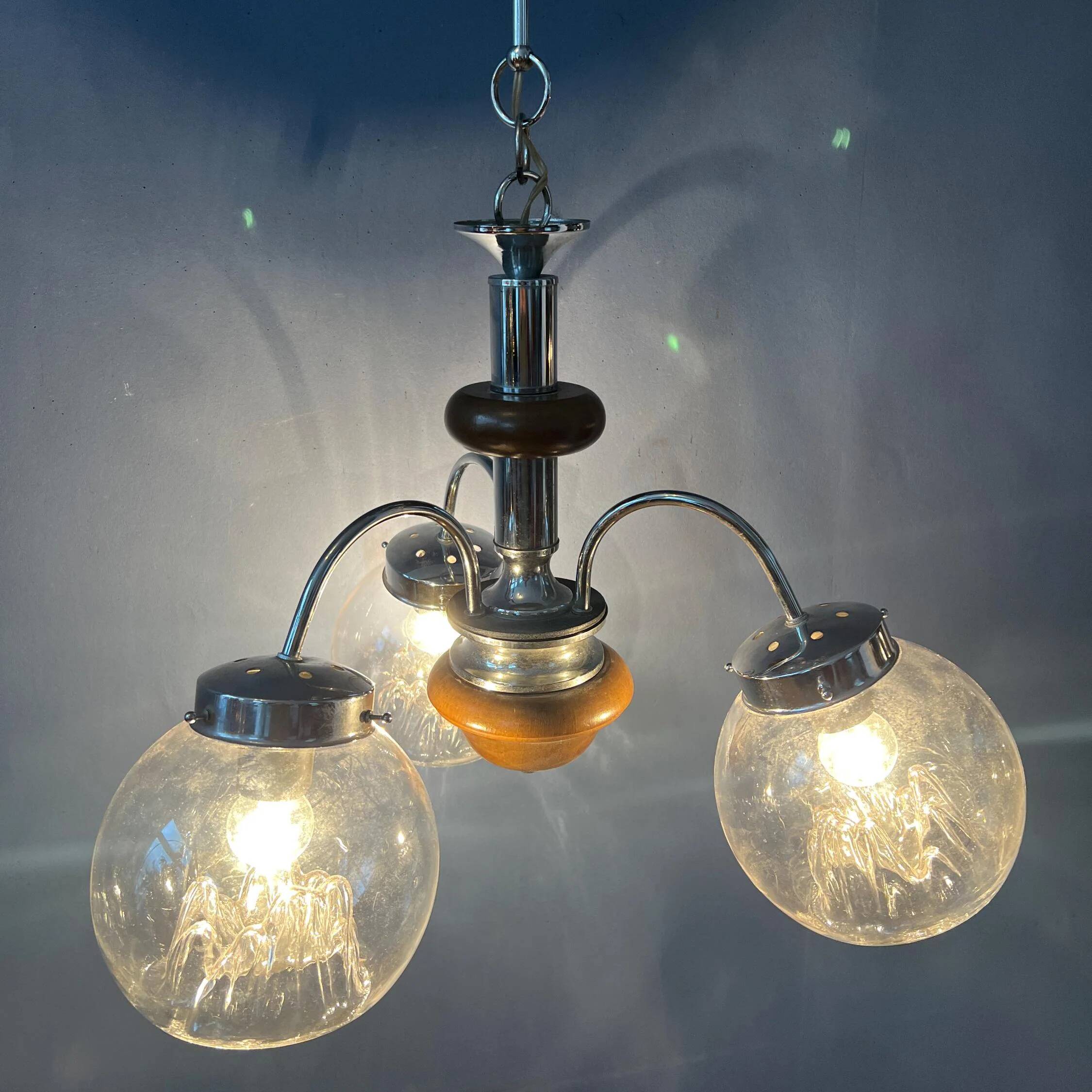 Vintage transparent glass chandelier from Murano with a chrome structure.