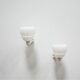 Pair of art deco porcelain and glass wall appliques