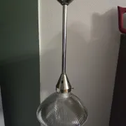 Vintage globe-style holophane on a chrome stem.
