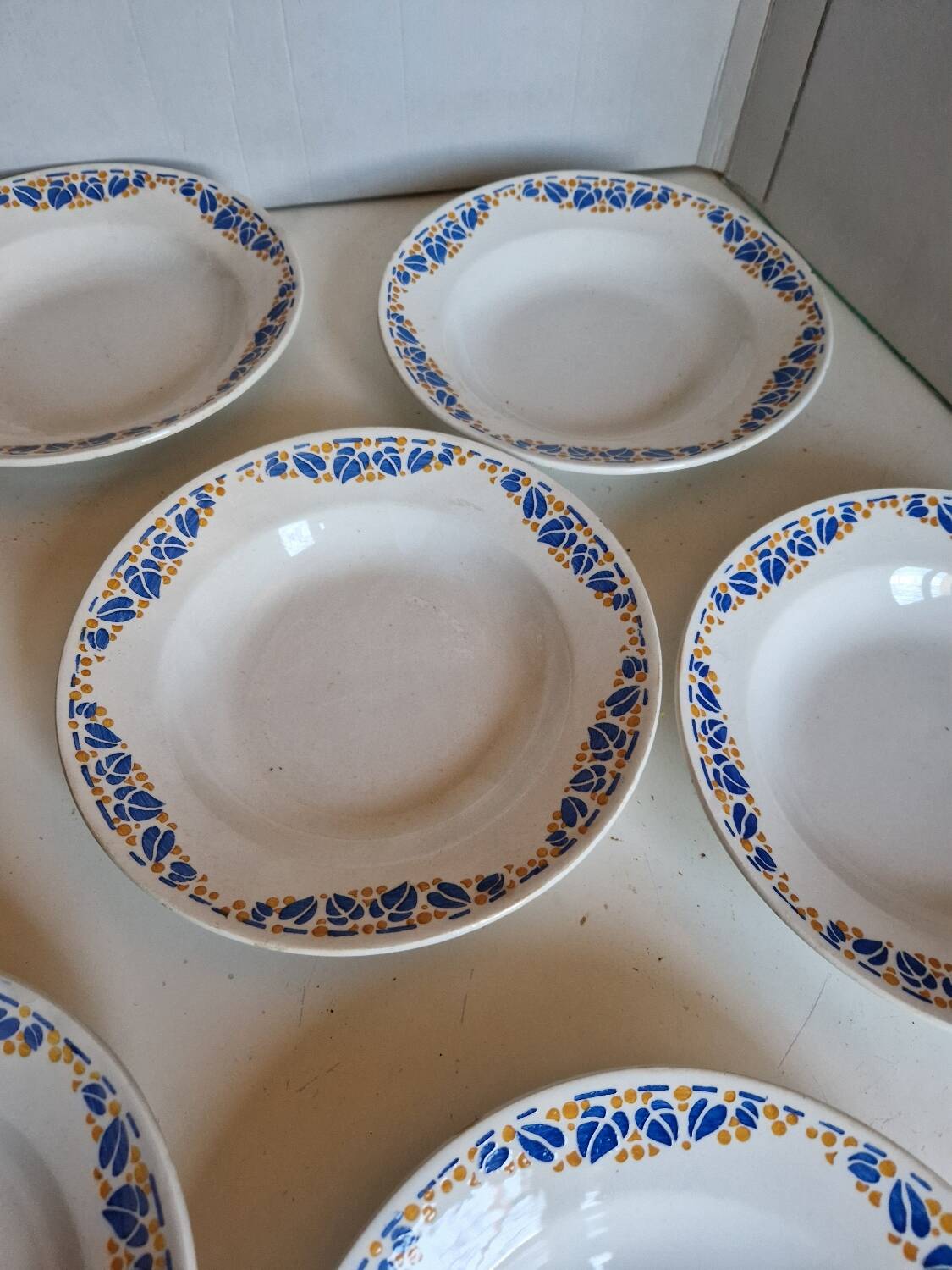 Set of 9 deep plates, earthenware from Creil Montereau, Colette model.
