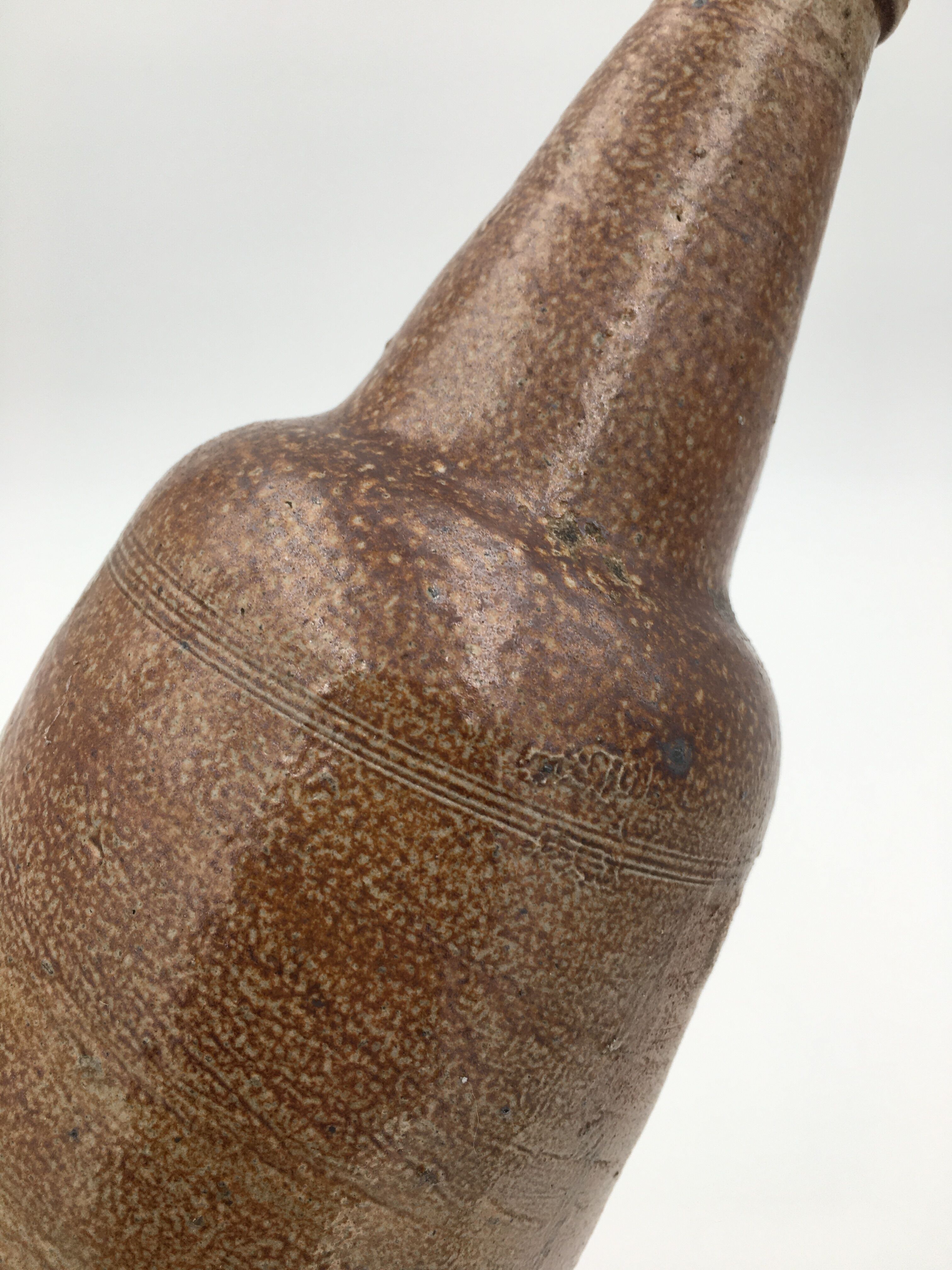 Old glazed terracotta bottle, early 20th century