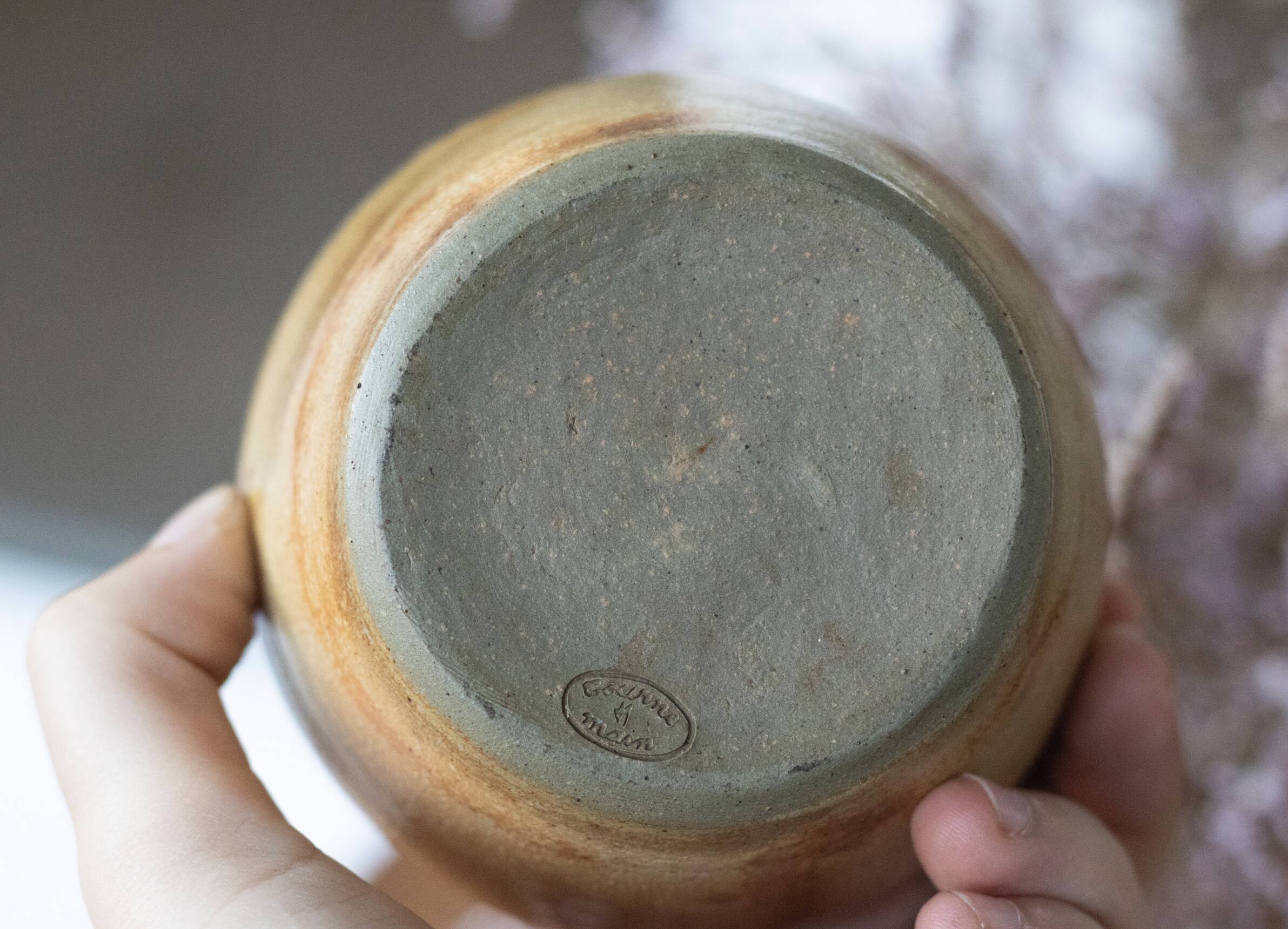 Signed sandstone flower pick