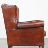 English style sheepskin leather wingback chair in a cognac color
