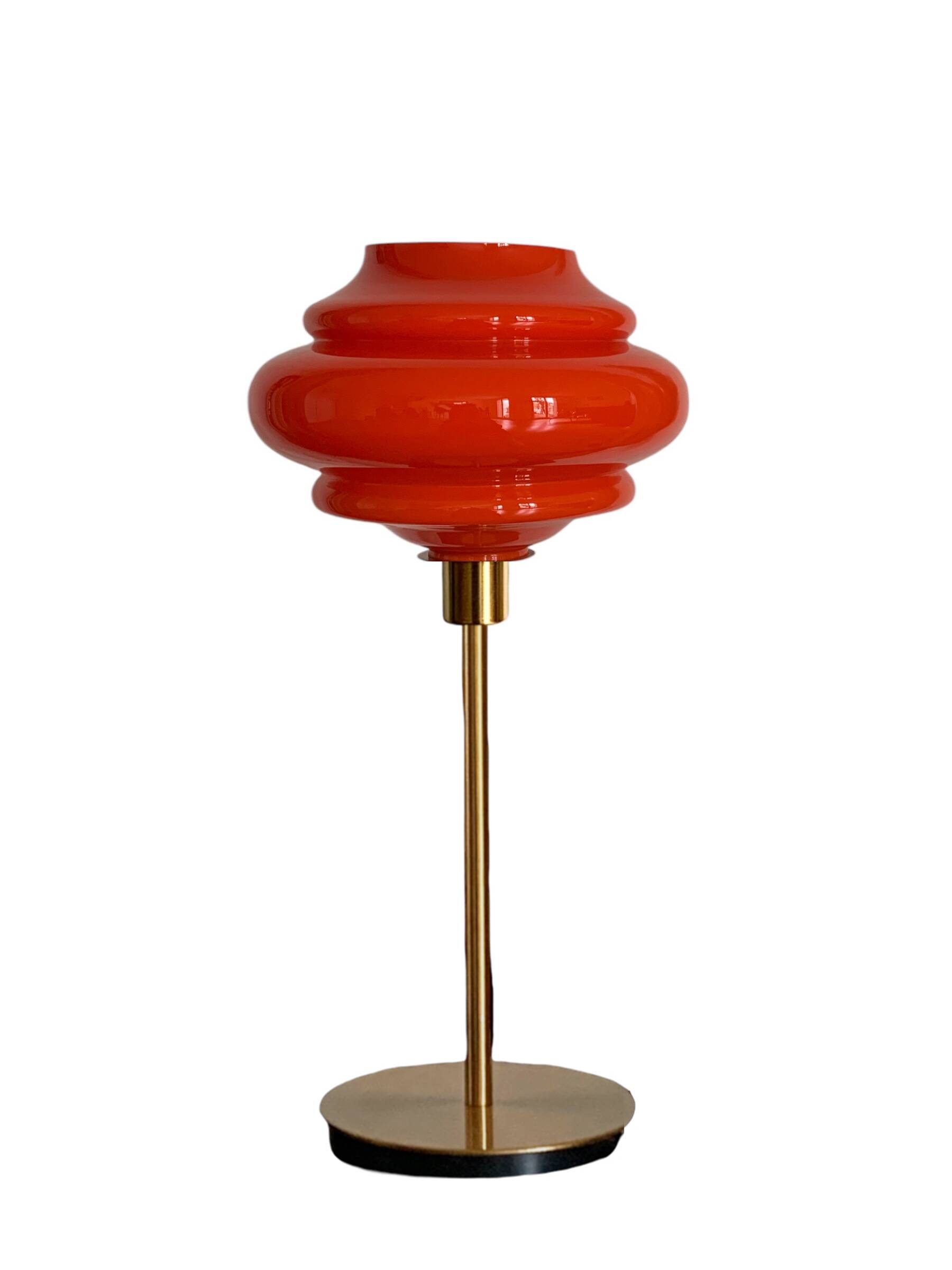 Table lamp with a vintage orange globe from an old pendant light