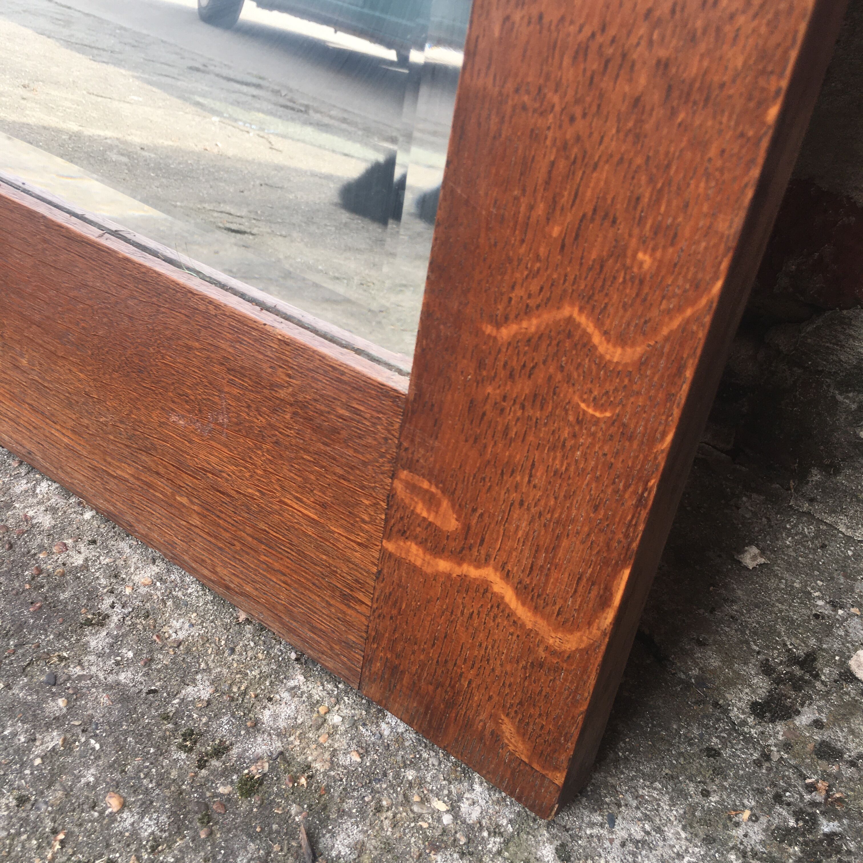 Beveled mirror made of fireplace wood