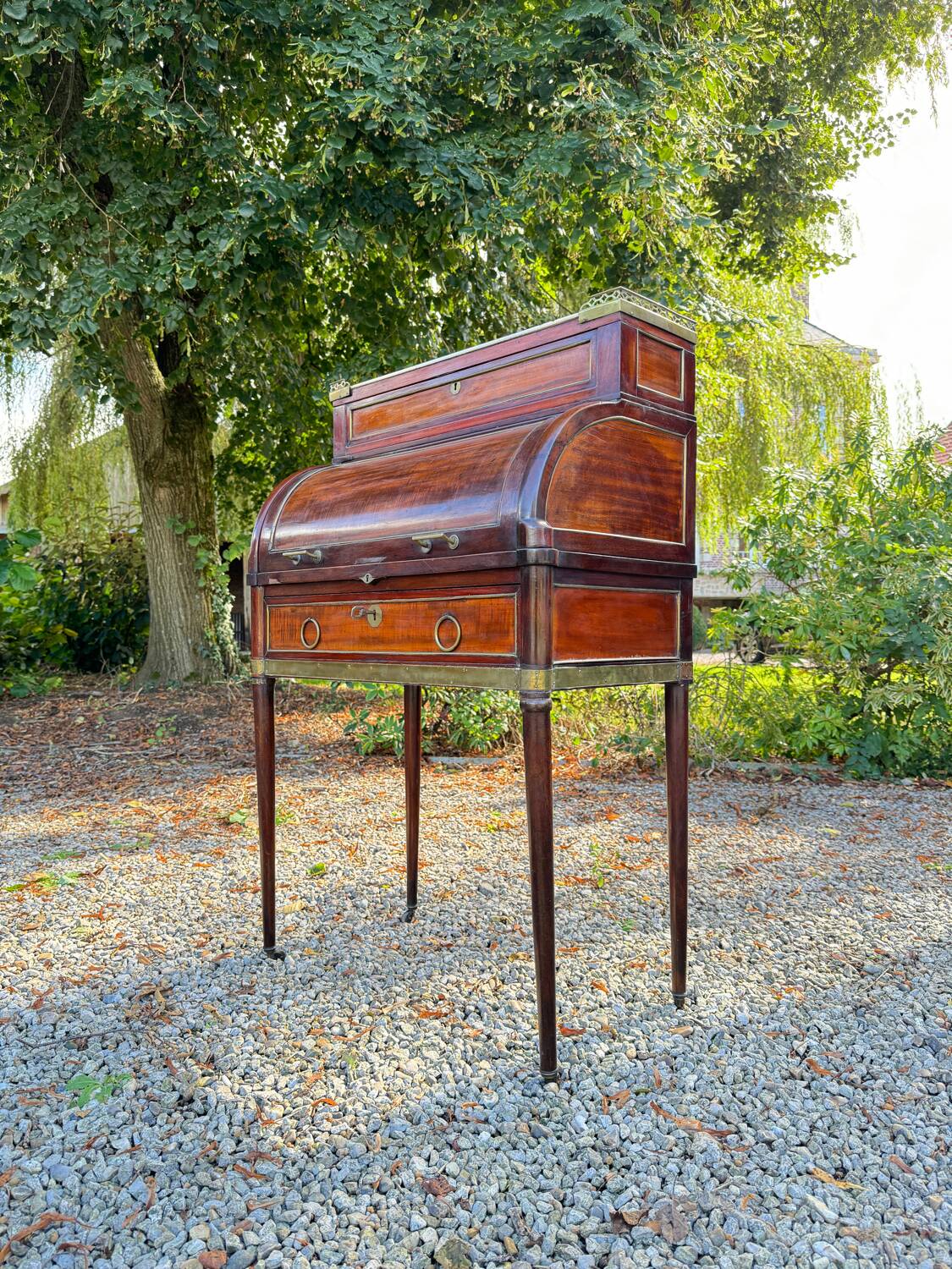 Elegant and rare Louis XVI period mahogany cylinder desk