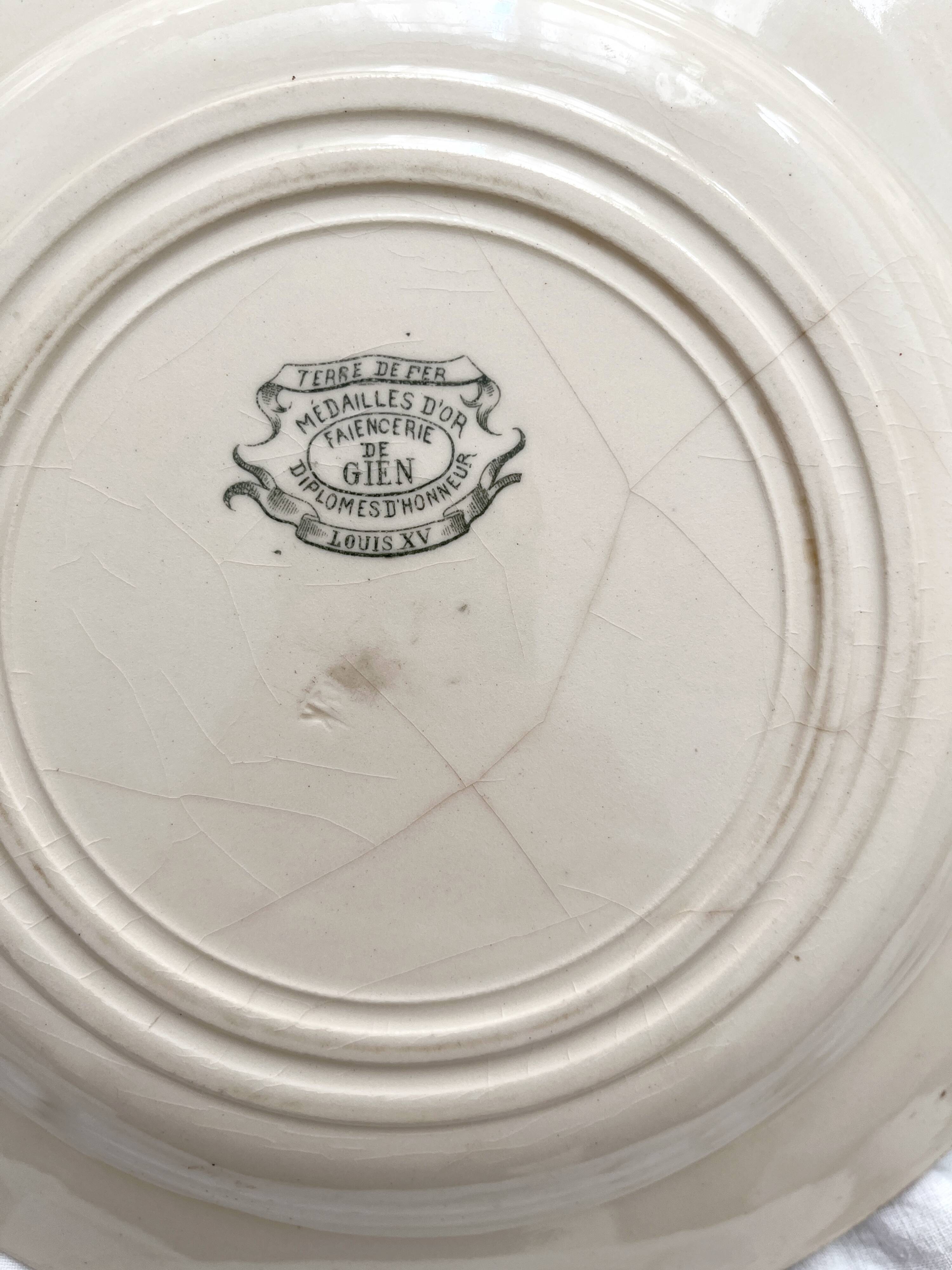 4 flat ironware plates "Louis XV" Gien 19th century