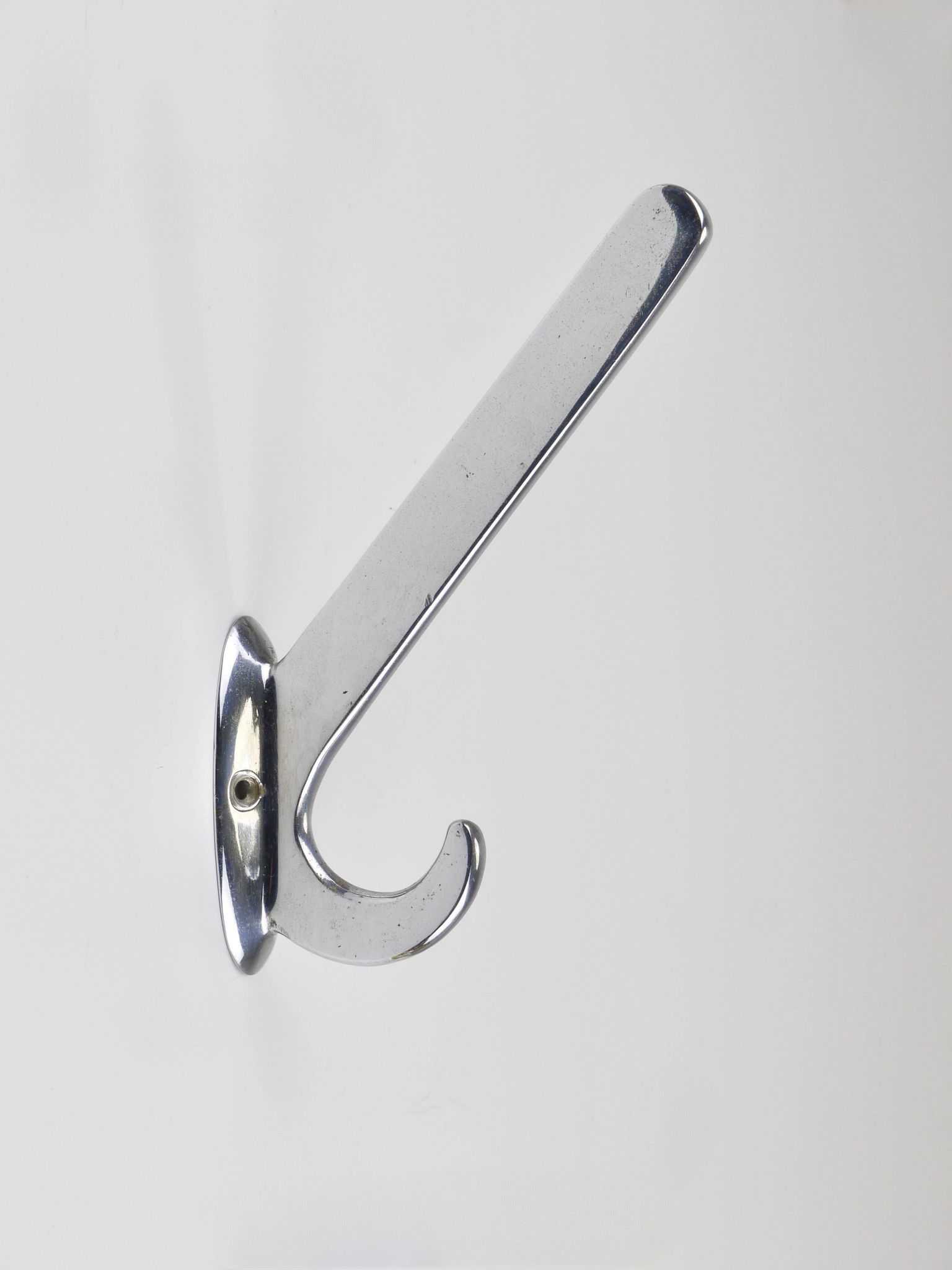 Up to 5 large Art Deco Bauhaus wall hooks in nickel and brass, Vienna, 1930s.
