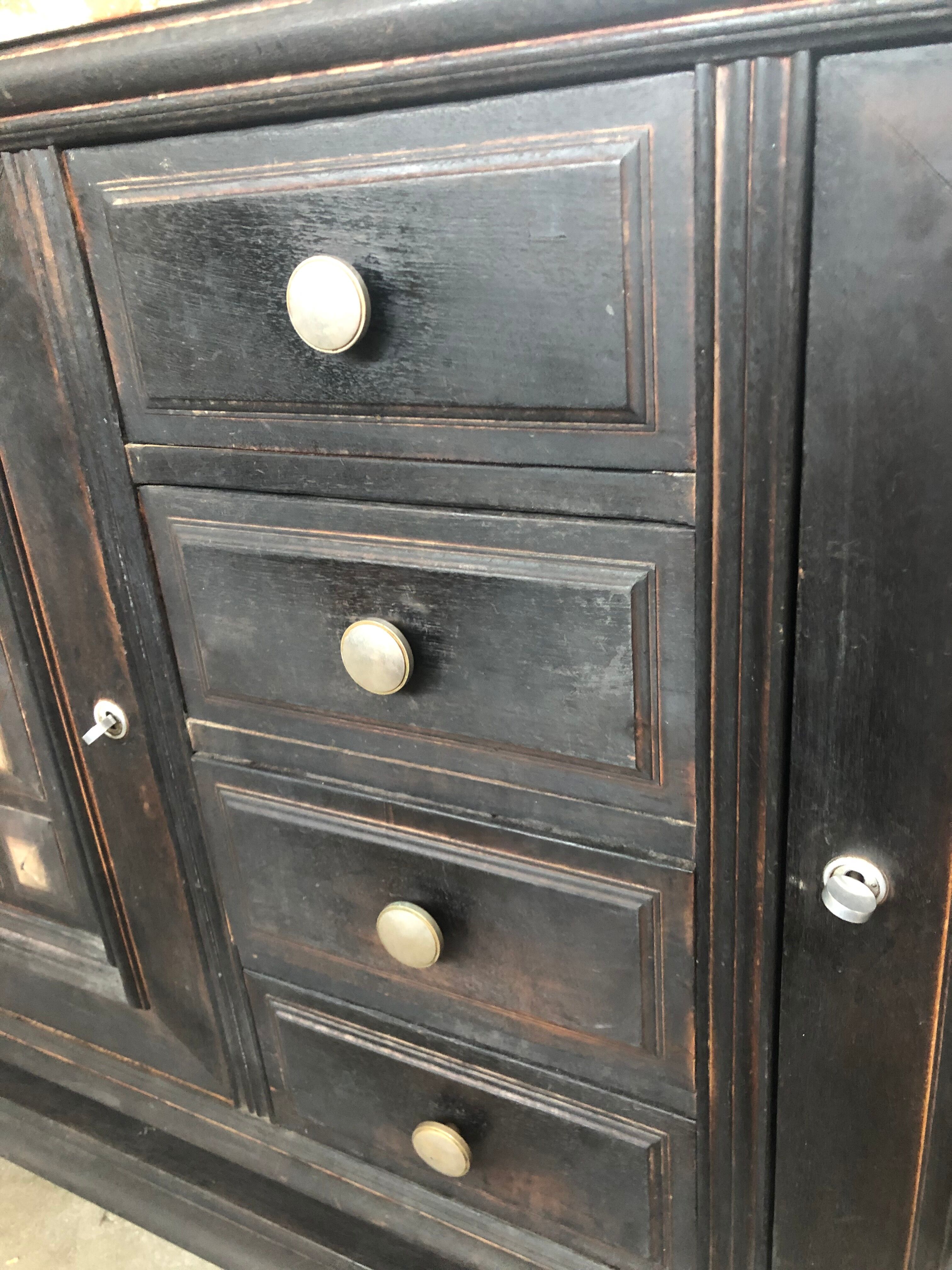 Blackened wooden sideboard of the 1950s