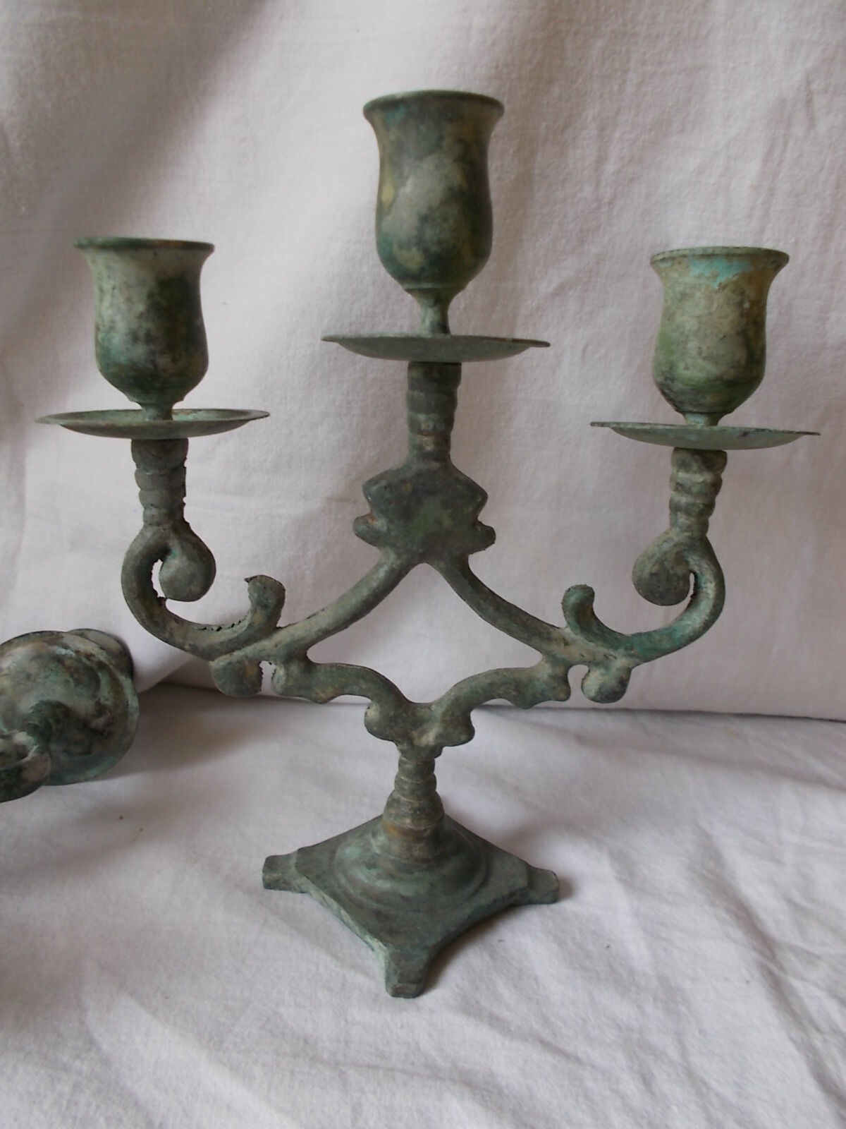 Pair of metal candlesticks patina green grey