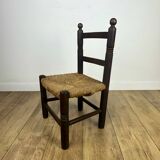 Pair of old wooden and straw children's chairs.