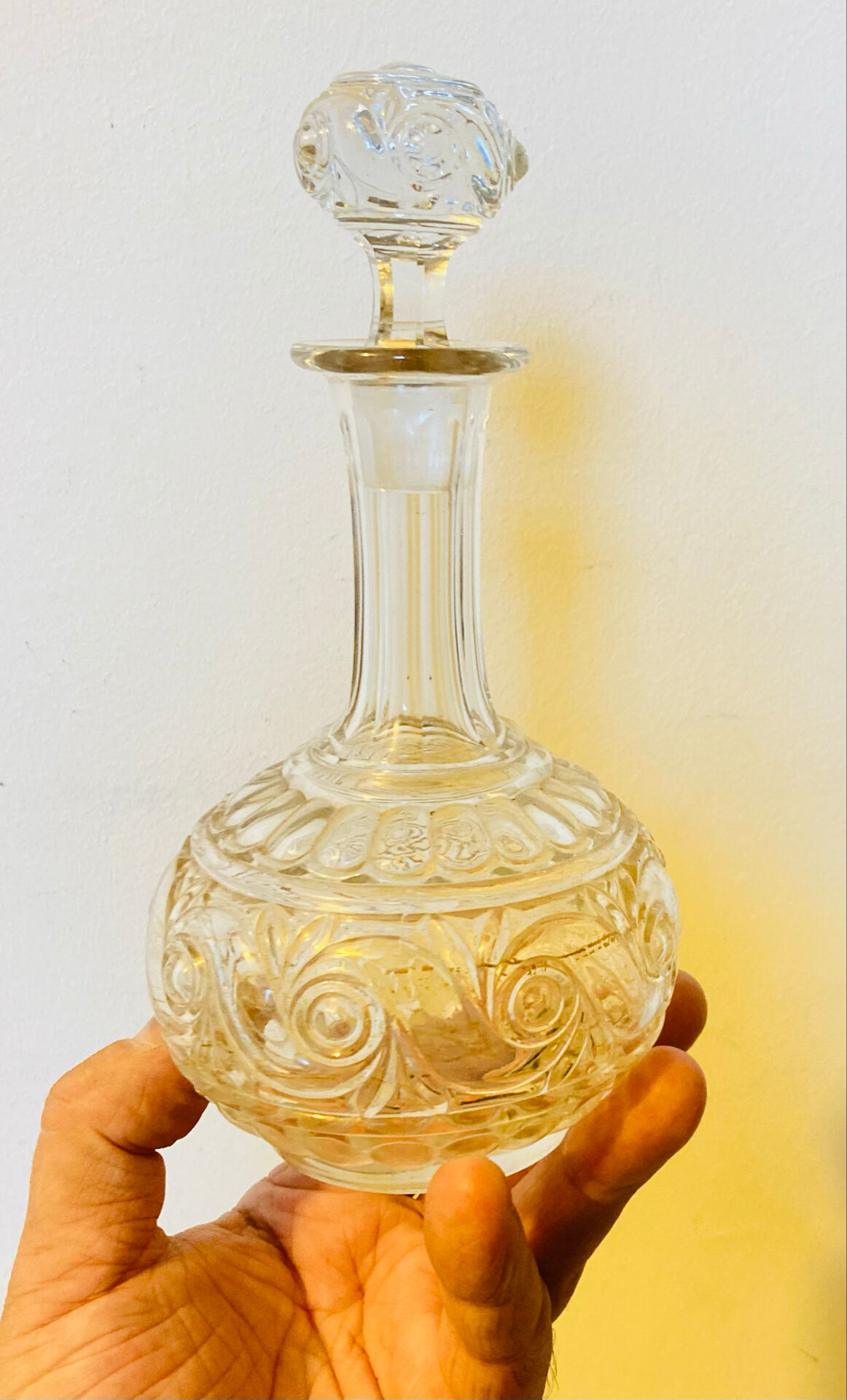 19th-century liqueur carafe in glass adorned with relief patterns.