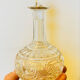 19th-century liqueur carafe in glass adorned with relief patterns.