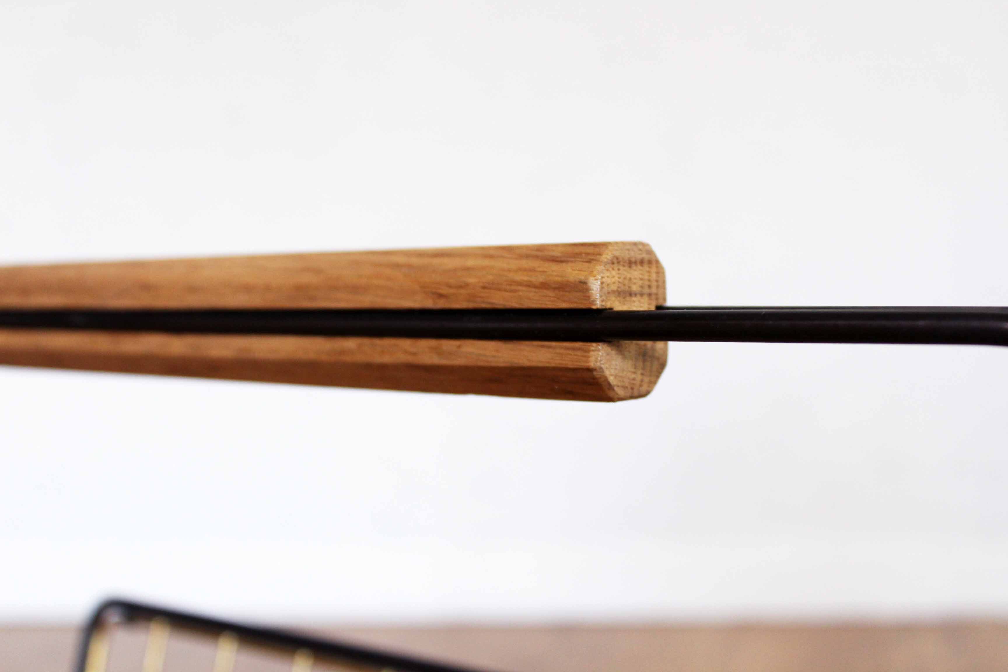 Metal magazine rack, wooden handle